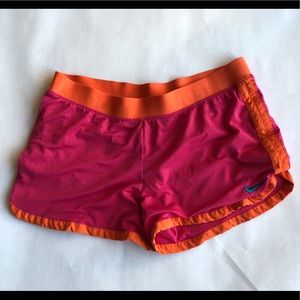 Magenta and orange Nike DryFit shorts